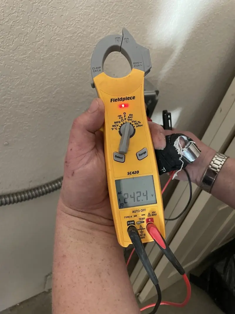 Voltage testing with clamp meter during Ceiling Fan Installation in Dunlap
